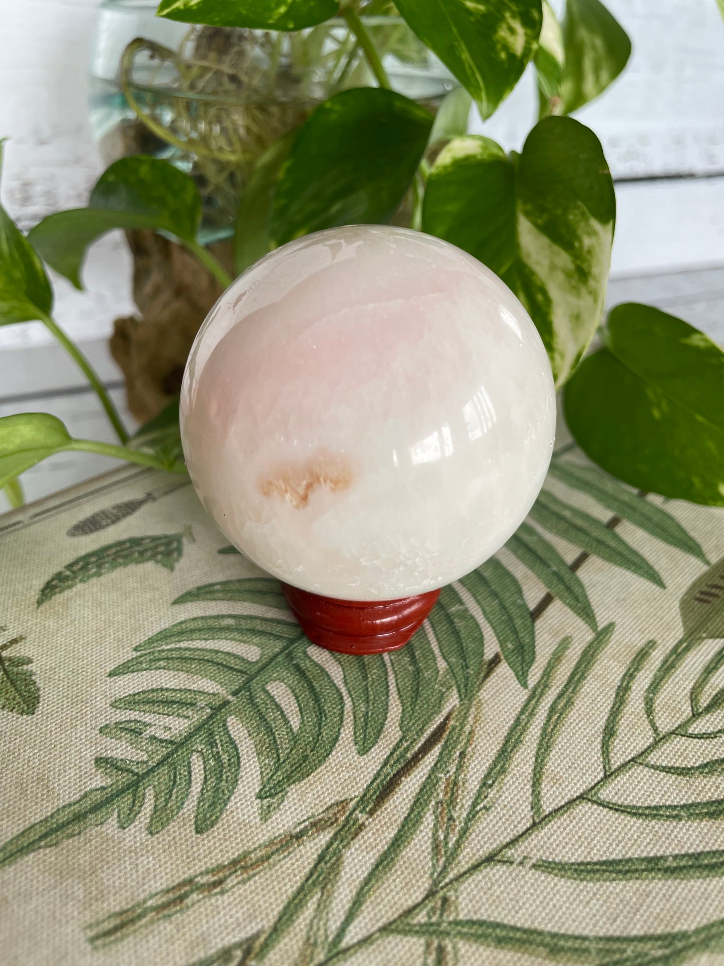 Mangano Calcite Sphere Includes Wooden Holder