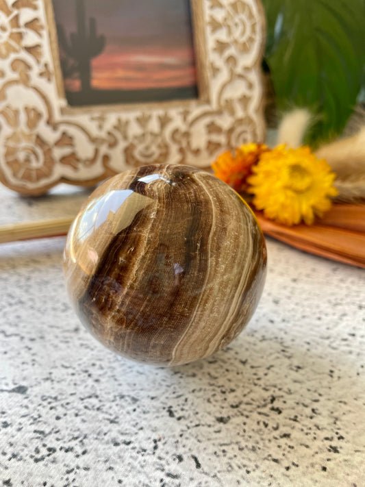 Chocolate Calcite Sphere Includes Wooden Holder