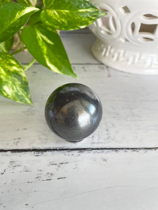 Hematite Sphere Includes Wooden Holder